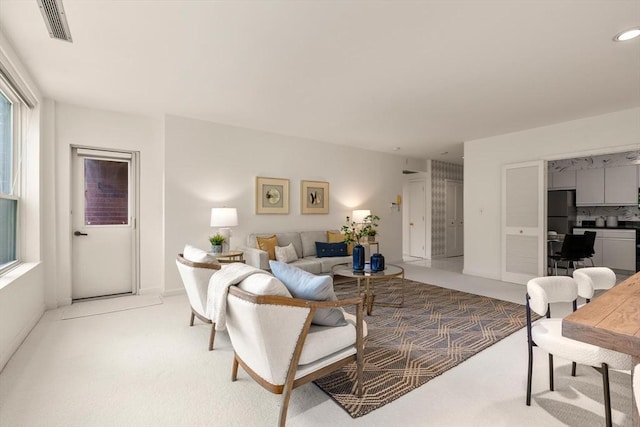 210 Nahanton St Unit 504, Newton, MA 02459 - living room with light colored carpet, an office area, and recessed lighting
