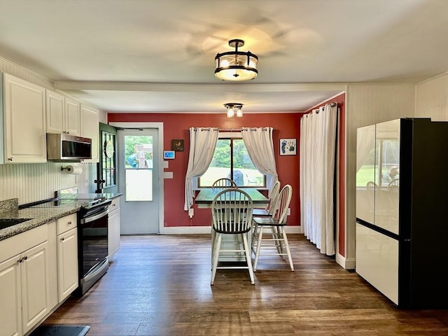 20 Benson St, Middleboro, MA 02346 - kitchen with appliances with stainless steel finishes, dark wood-type flooring, white cabinets, and light stone counters