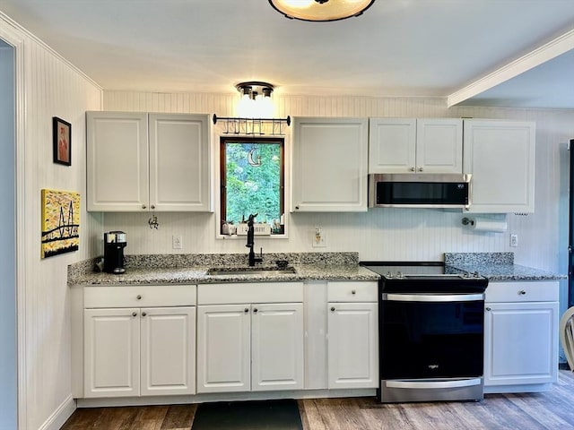 20 Benson St, Middleboro, MA 02346 - kitchen with stainless steel appliances, wood finished floors, white cabinetry, crown molding, and light stone counters