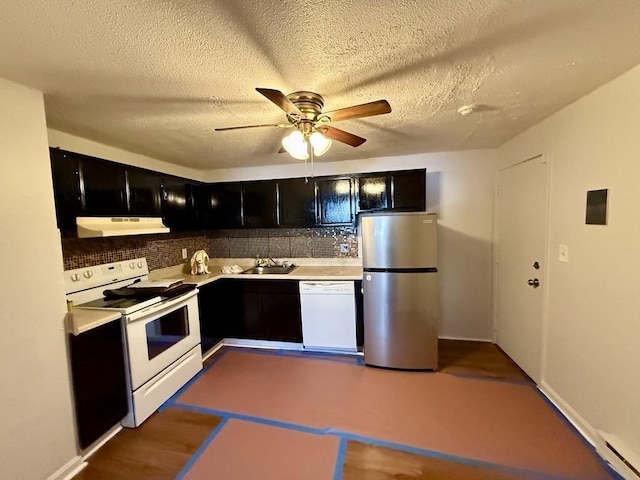 kitchen featuring ceiling fan, tasteful backsplash, white appliances, a textured ceiling, and sink