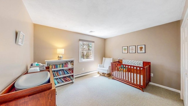 bedroom featuring carpet flooring, baseboards, visible vents, and a baseboard radiator