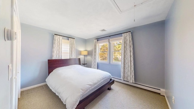 bedroom featuring visible vents, baseboards, attic access, baseboard heating, and carpet