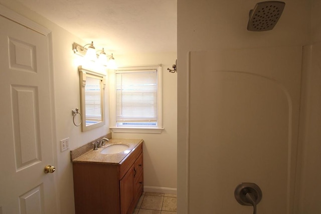 75 Wachusett St, Franklin, MA 02038 - full bath with vanity, tile patterned flooring, and baseboards
