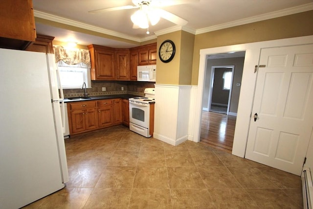 75 Wachusett St, Franklin, MA 02038 - kitchen with white appliances, a sink, a ceiling fan, brown cabinets, and crown molding