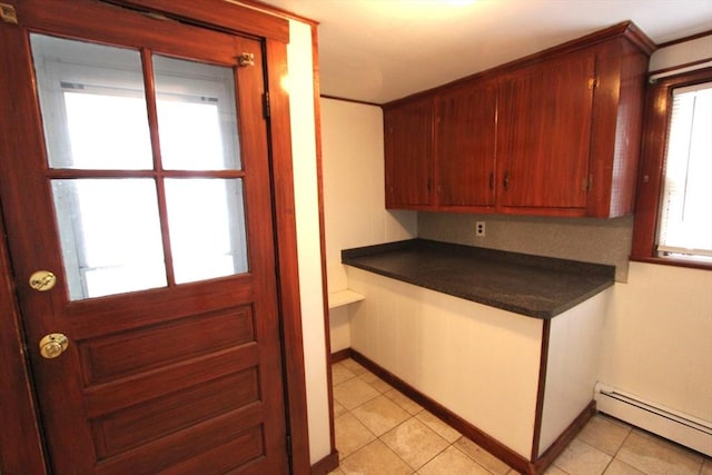 75 Wachusett St, Franklin, MA 02038 - kitchen featuring a baseboard radiator, dark countertops, light tile patterned floors, and baseboards