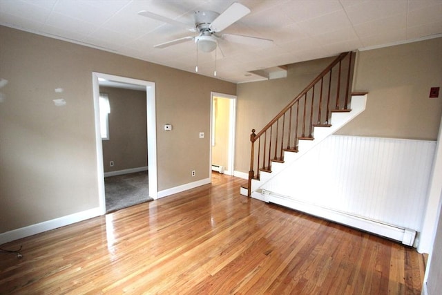75 Wachusett St, Franklin, MA 02038 - unfurnished living room with a baseboard heating unit, stairs, ceiling fan, and light wood-type flooring