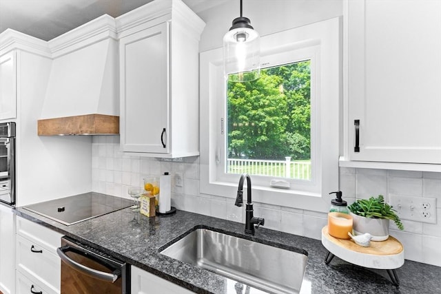 100 Gilbert St, Mansfield, MA 02048 - kitchen with a sink, black electric cooktop, white cabinets, and tasteful backsplash