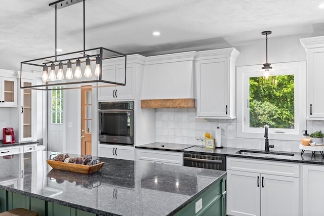 100 Gilbert St, Mansfield, MA 02048 - kitchen featuring stainless steel oven, a sink, white cabinetry, black electric stovetop, and recessed lighting
