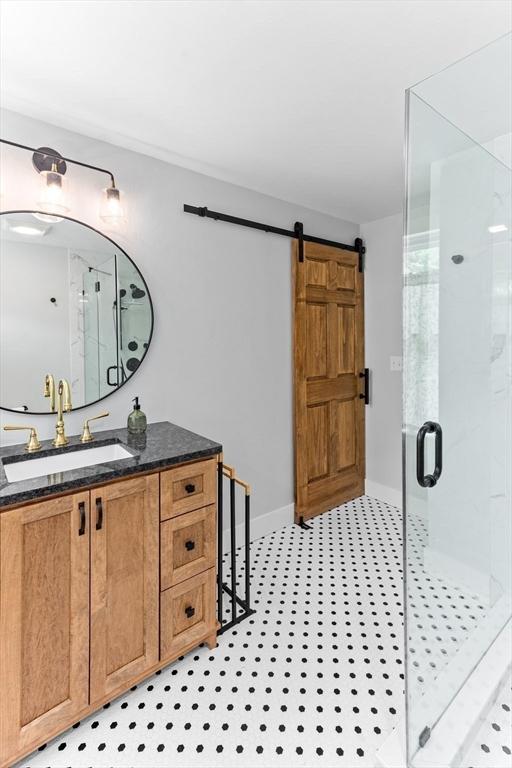 100 Gilbert St, Mansfield, MA 02048 - full bath with a stall shower, vanity, and baseboards
