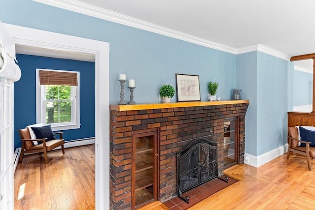 100 Gilbert St, Mansfield, MA 02048 - living area featuring a brick fireplace, ornamental molding, baseboards, and wood finished floors