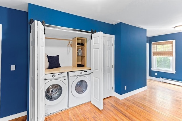 100 Gilbert St, Mansfield, MA 02048 - laundry room featuring independent washer and dryer, a barn door, light wood-style floors, baseboards, and a baseboard heating unit