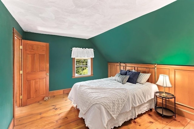100 Gilbert St, Mansfield, MA 02048 - bedroom featuring hardwood / wood-style floors, lofted ceiling, and baseboards