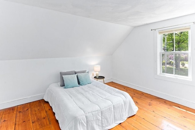 100 Gilbert St, Mansfield, MA 02048 - bedroom featuring lofted ceiling, baseboards, and hardwood / wood-style flooring
