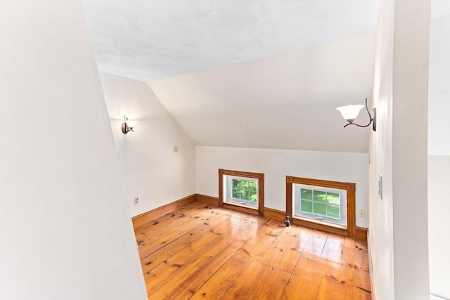 100 Gilbert St, Mansfield, MA 02048 - bonus room featuring hardwood / wood-style floors, vaulted ceiling, and baseboards