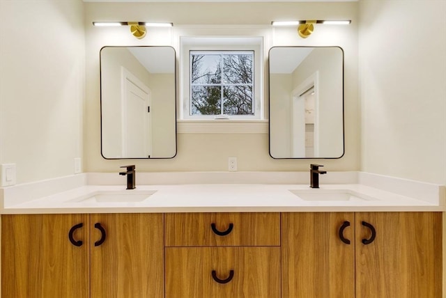 bathroom featuring double vanity and a sink