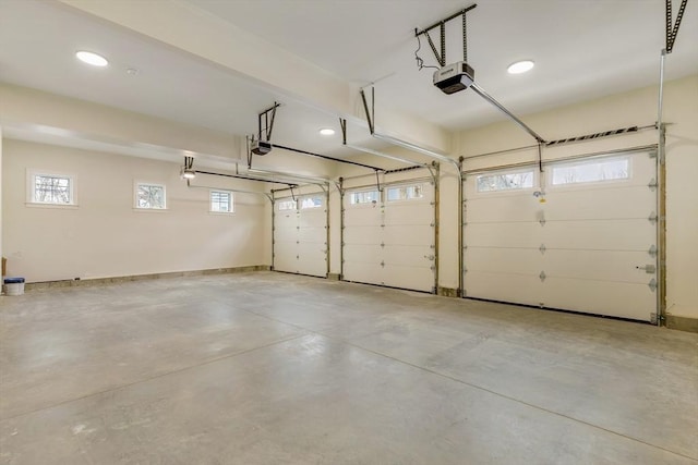 garage featuring baseboards and a garage door opener