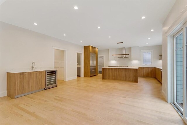 interior space featuring wood finished floors, vanity, and recessed lighting