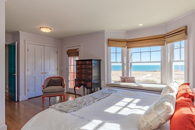 17 Mattarest Ln, Dartmouth, MA 02748 - bedroom featuring ornamental molding, wood finished floors, a closet, and a water view