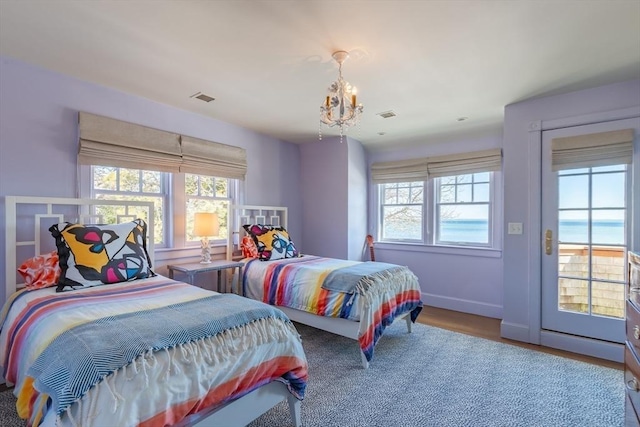 17 Mattarest Ln, Dartmouth, MA 02748 - bedroom with a chandelier and wood finished floors