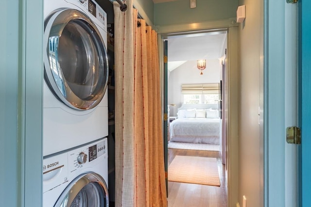 17 Mattarest Ln, Dartmouth, MA 02748 - laundry area with estacked washer and dryer and wood finished floors