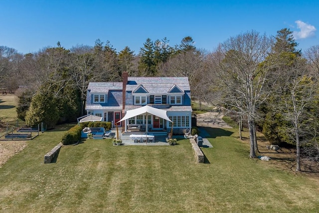 17 Mattarest Ln, Dartmouth, MA 02748 - rear view of house with an outdoor hangout area, a patio area, a yard, and a chimney