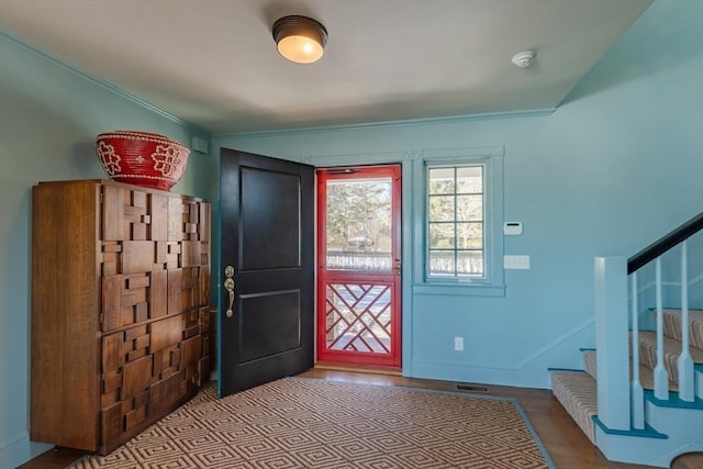 17 Mattarest Ln, Dartmouth, MA 02748 - entryway featuring stairway, wood finished floors, and ornamental molding