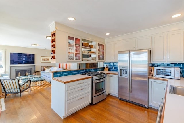 17 Mattarest Ln, Dartmouth, MA 02748 - kitchen with stainless steel appliances, light countertops, white cabinetry, backsplash, and recessed lighting