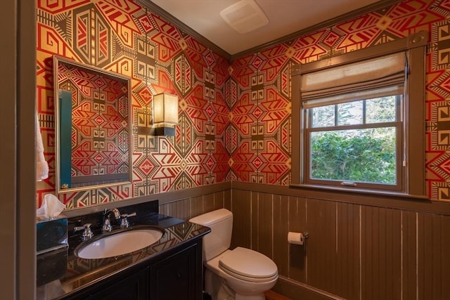 17 Mattarest Ln, Dartmouth, MA 02748 - half bath with vanity, wallpapered walls, a wainscoted wall, and ornamental molding