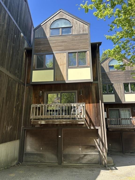 rear view of house featuring a balcony