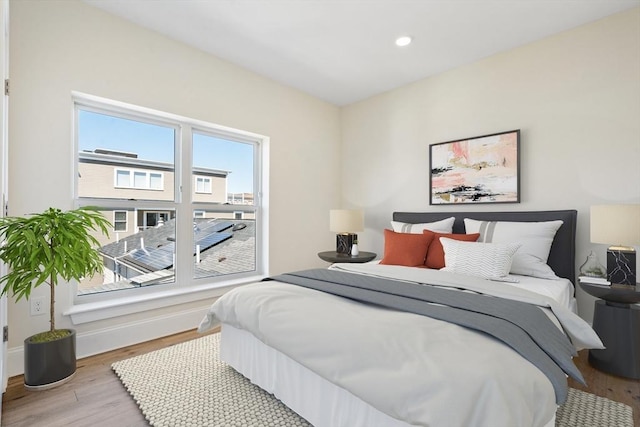 bedroom with light hardwood / wood-style floors