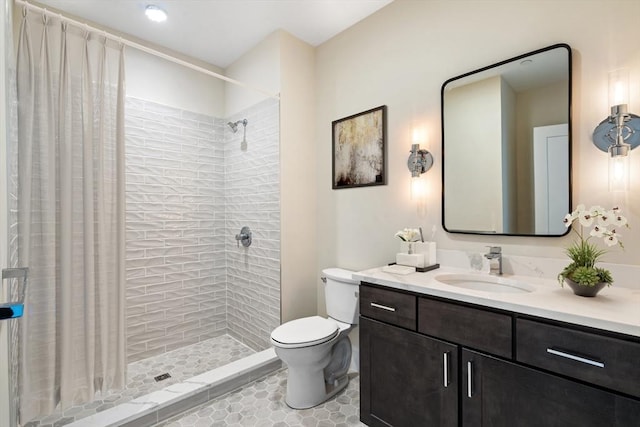 bathroom with tile patterned flooring, vanity, toilet, and a shower with shower curtain