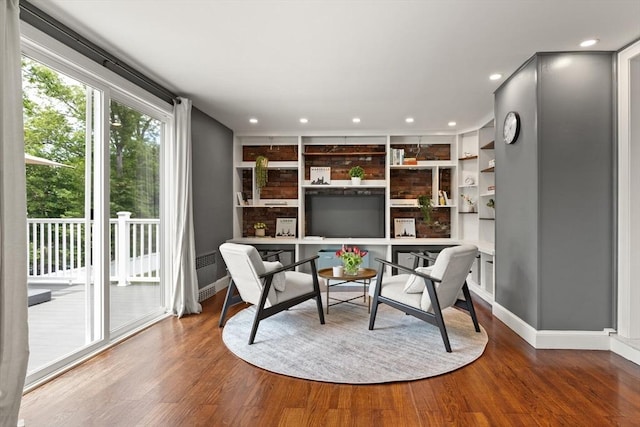 141 Jewett St Unit 2, Newton, MA 02458 - living area featuring baseboards, wood finished floors, recessed lighting, and built in features