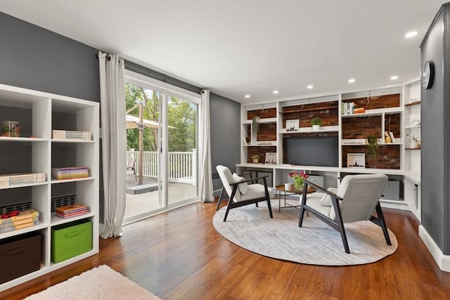 141 Jewett St Unit 2, Newton, MA 02458 - sitting room featuring dark wood-style floors, recessed lighting, and built in shelves