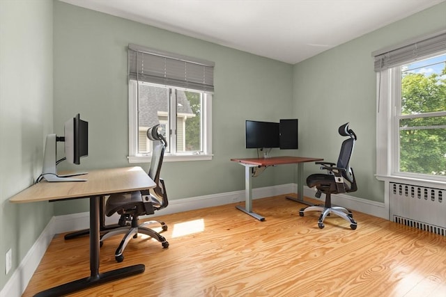 141 Jewett St Unit 2, Newton, MA 02458 - office area featuring radiator heating unit, wood finished floors, and baseboards
