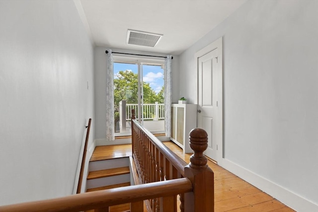 141 Jewett St Unit 2, Newton, MA 02458 - staircase featuring baseboards and hardwood / wood-style flooring