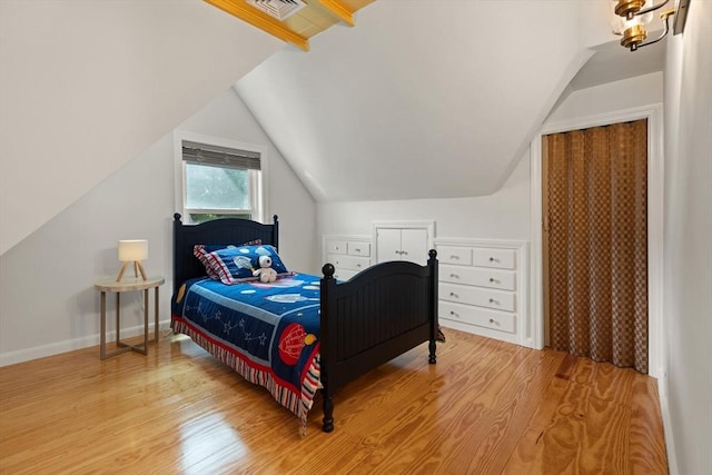 141 Jewett St Unit 2, Newton, MA 02458 - bedroom featuring wood finished floors, lofted ceiling, and baseboards