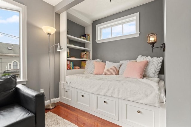 141 Jewett St Unit 2, Newton, MA 02458 - bedroom featuring wood finished floors and baseboards