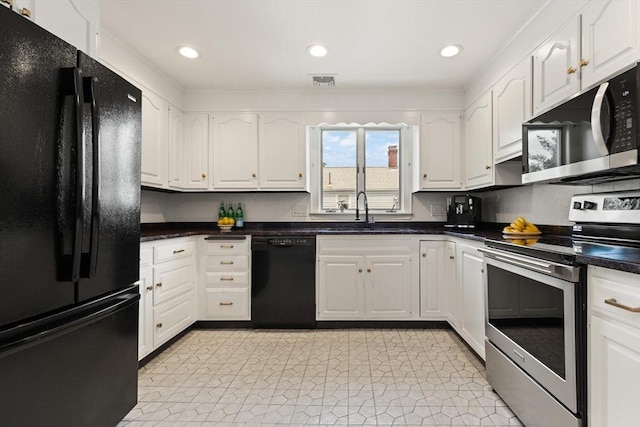 141 Jewett St Unit 2, Newton, MA 02458 - kitchen featuring black appliances, a sink, white cabinetry, dark countertops, and recessed lighting