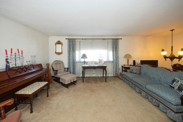 living room with carpet floors and an inviting chandelier