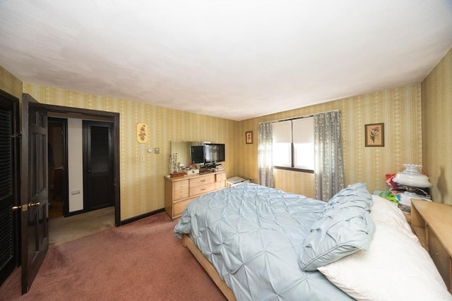 carpeted bedroom featuring baseboards and wallpapered walls