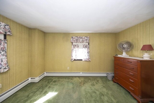 unfurnished bedroom with carpet floors and a baseboard radiator