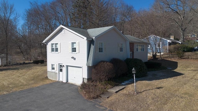 exterior space with a garage and driveway