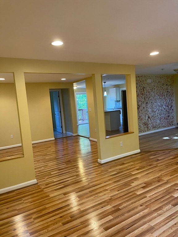 empty room with light hardwood / wood-style flooring