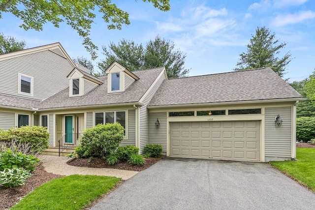 1205 Magnolia Dr Unit 1205, Wayland, MA 01778 - new england style home featuring driveway, a shingled roof, and a garage