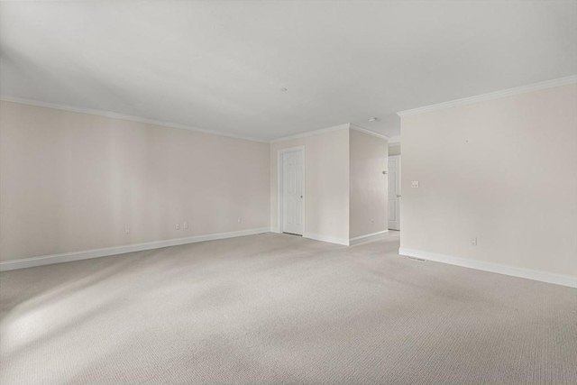 1205 Magnolia Dr Unit 1205, Wayland, MA 01778 - unfurnished room featuring crown molding, baseboards, and light carpet
