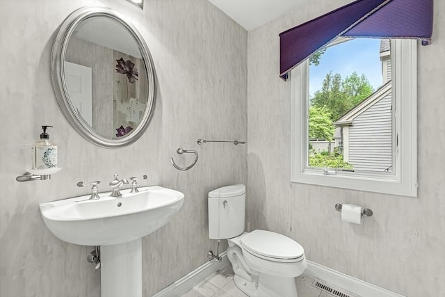 1205 Magnolia Dr Unit 1205, Wayland, MA 01778 - bathroom with baseboards, toilet, and tile patterned floors