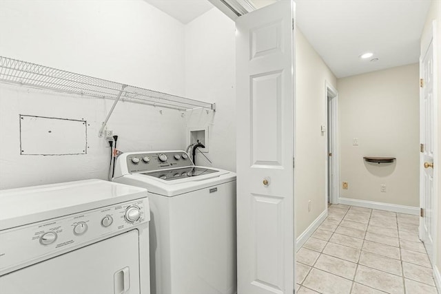 1205 Magnolia Dr Unit 1205, Wayland, MA 01778 - laundry room with washer and clothes dryer, light tile patterned floors, baseboards, and recessed lighting