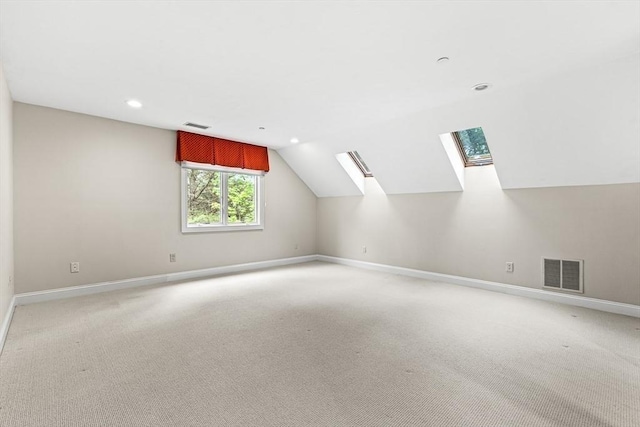 1205 Magnolia Dr Unit 1205, Wayland, MA 01778 - bonus room featuring baseboards, a skylight, light carpet, lofted ceiling, and recessed lighting