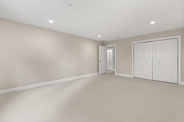 1205 Magnolia Dr Unit 1205, Wayland, MA 01778 - unfurnished bedroom featuring light carpet, baseboards, recessed lighting, and a closet