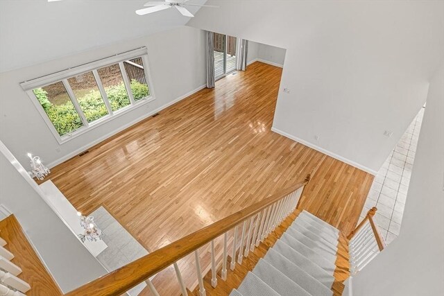 1205 Magnolia Dr Unit 1205, Wayland, MA 01778 - stairway with wood finished floors, baseboards, vaulted ceiling, and ceiling fan